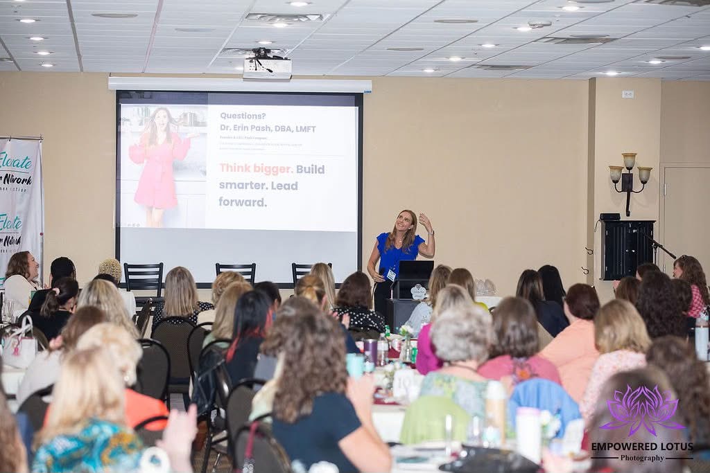 Erin Pash presenting to a full room